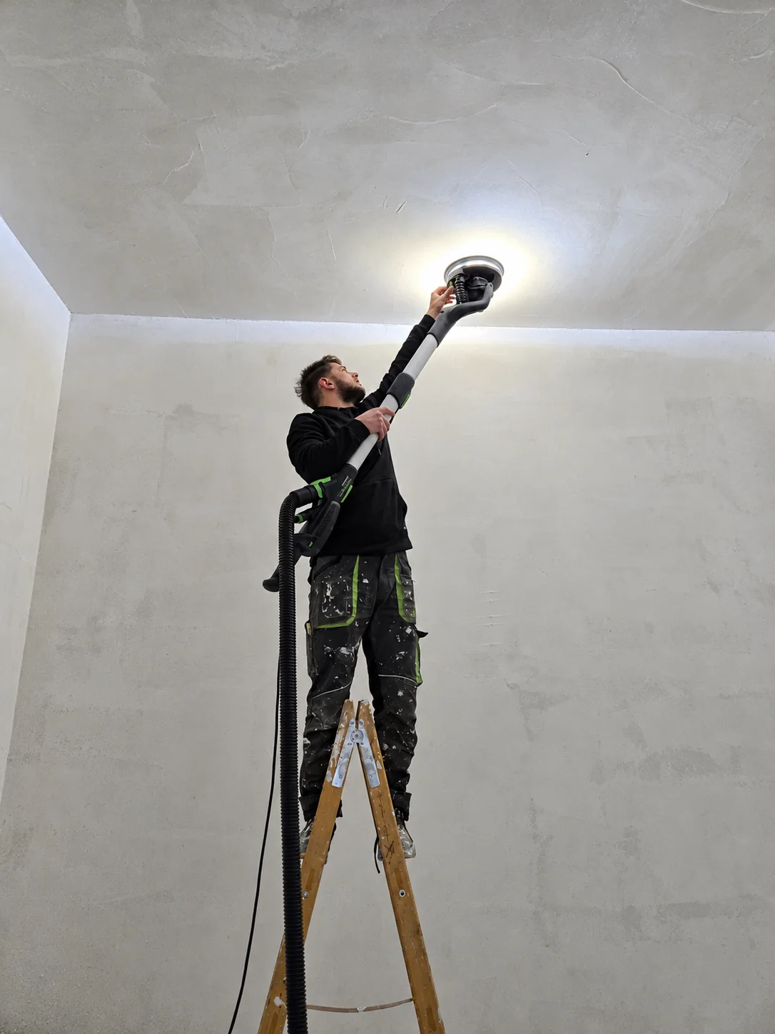 Sanding and preparing the ceiling at Starše Library